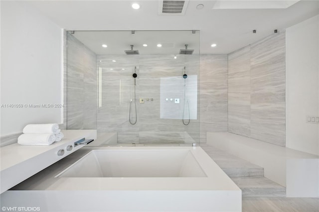 bathroom featuring plus walk in shower