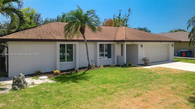 single story home with a front lawn and a garage