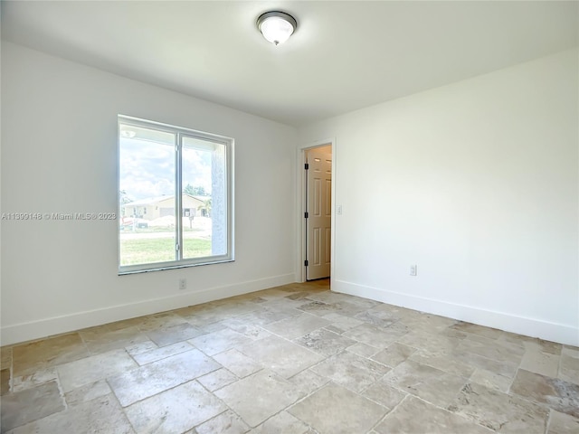 spare room featuring light tile floors