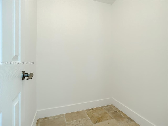 washroom featuring light tile flooring