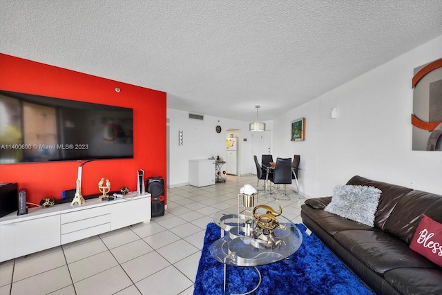 tiled living room with a textured ceiling