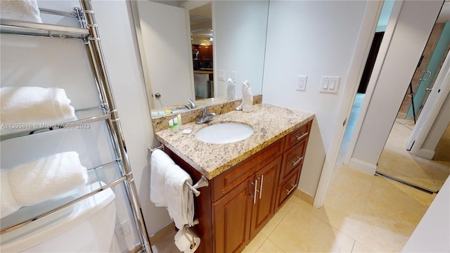 bathroom with vanity and tile flooring