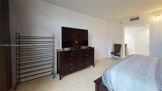 bedroom with light carpet