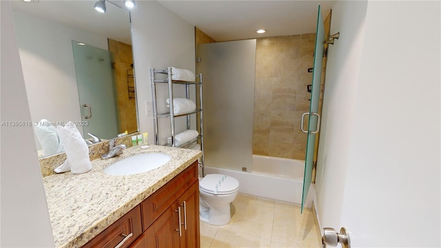 full bathroom featuring vanity, tile flooring, enclosed tub / shower combo, and toilet