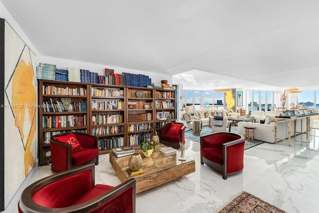 sitting room featuring light tile floors and plenty of natural light