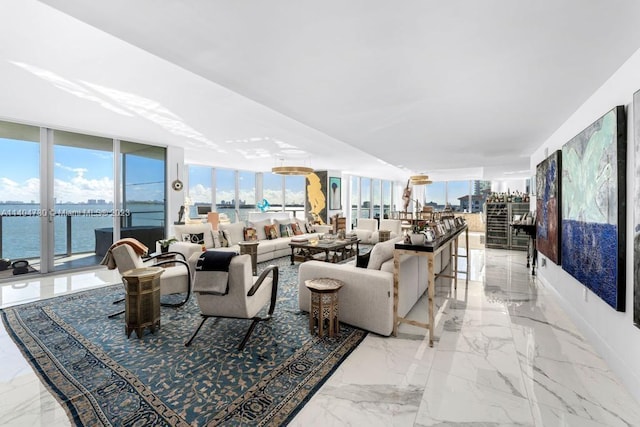 tiled living room with floor to ceiling windows and a water view