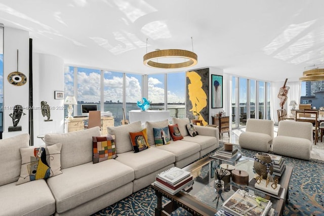 living room featuring a water view and floor to ceiling windows