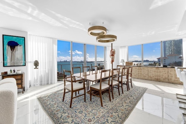 tiled dining room with a water view