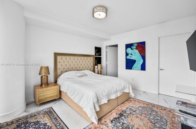 bedroom with light tile floors