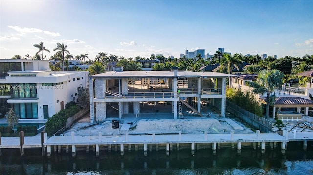 back of property with a water view