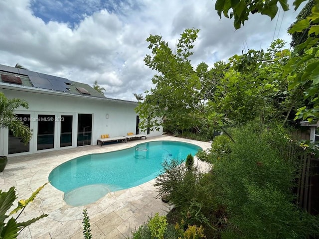 view of pool featuring a patio area