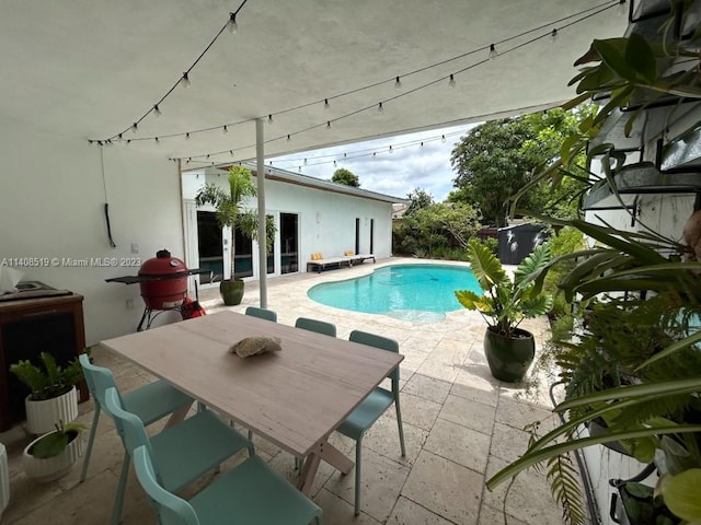 view of swimming pool with a patio area