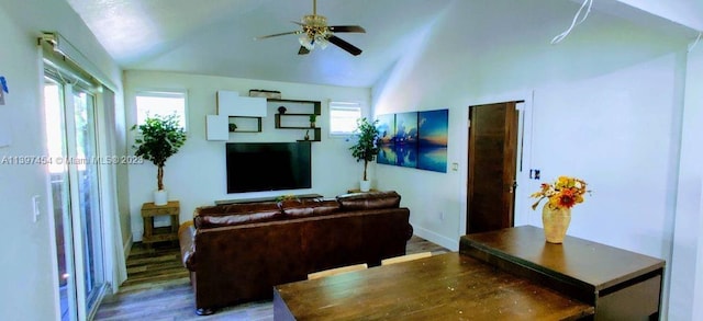 living room featuring hardwood / wood-style floors, vaulted ceiling, and ceiling fan