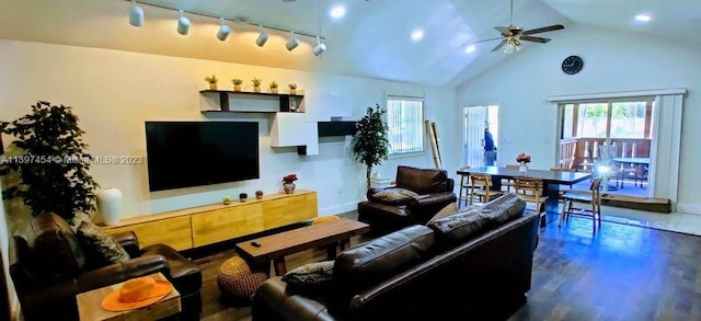 living room with track lighting, dark wood-type flooring, high vaulted ceiling, and ceiling fan