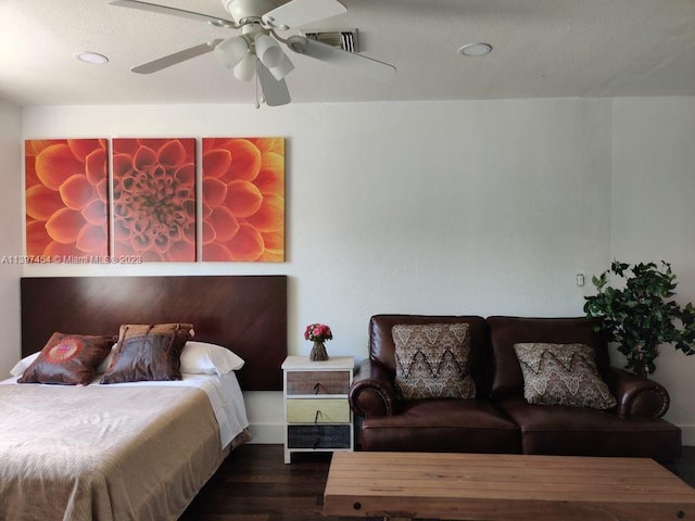 bedroom with dark hardwood / wood-style floors and ceiling fan