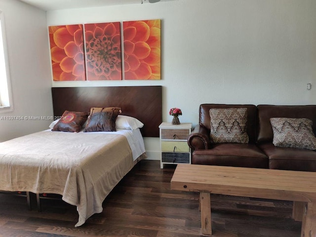 bedroom featuring dark wood-type flooring