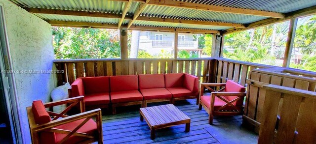 wooden terrace featuring an outdoor hangout area