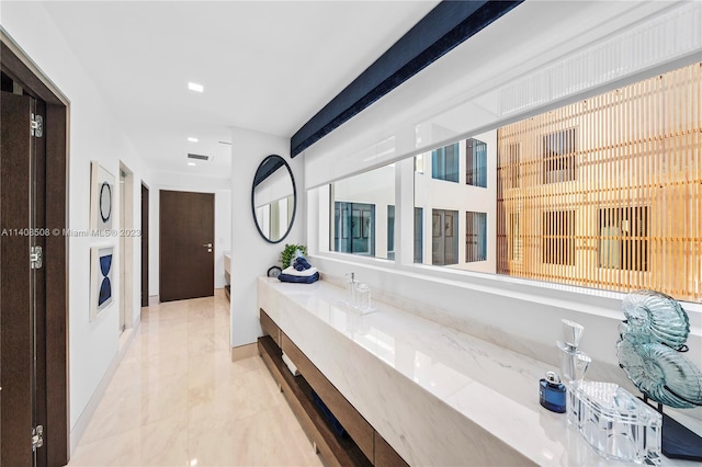 bathroom with vanity and tile flooring