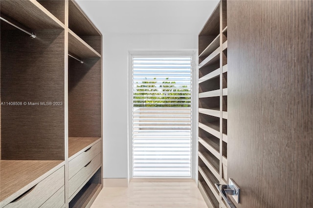 walk in closet featuring light wood-type flooring