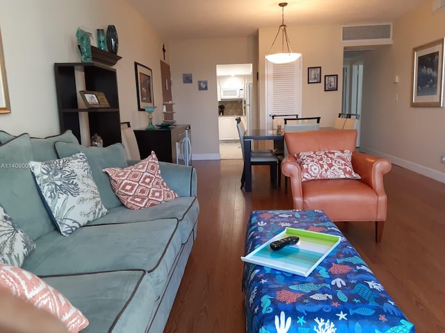 living room featuring dark hardwood / wood-style flooring