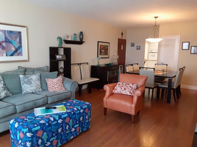 living room with dark wood-type flooring