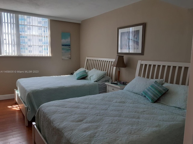 bedroom with wood-type flooring