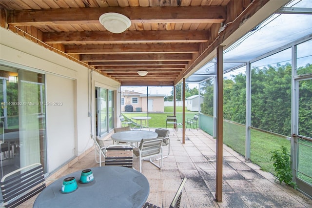 sunroom featuring wood ceiling and beamed ceiling