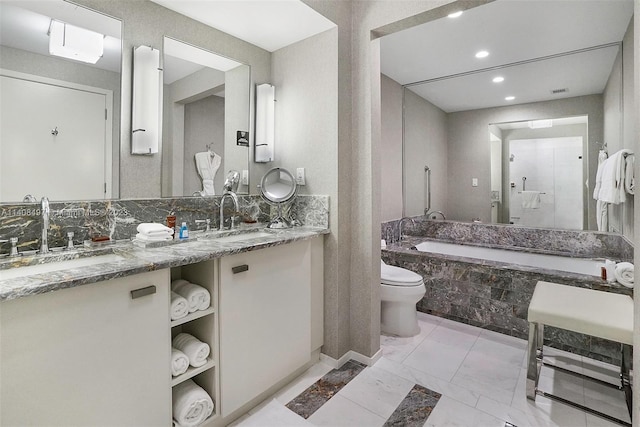 full bathroom featuring toilet, dual sinks, tile flooring, separate shower and tub, and large vanity