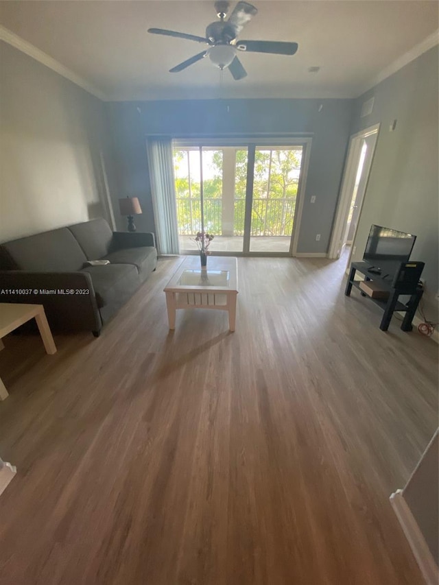 living room featuring ornamental molding, ceiling fan, and light hardwood / wood-style flooring