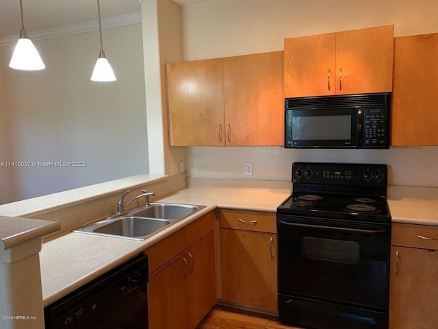 kitchen featuring black appliances, sink, light hardwood / wood-style flooring, crown molding, and pendant lighting