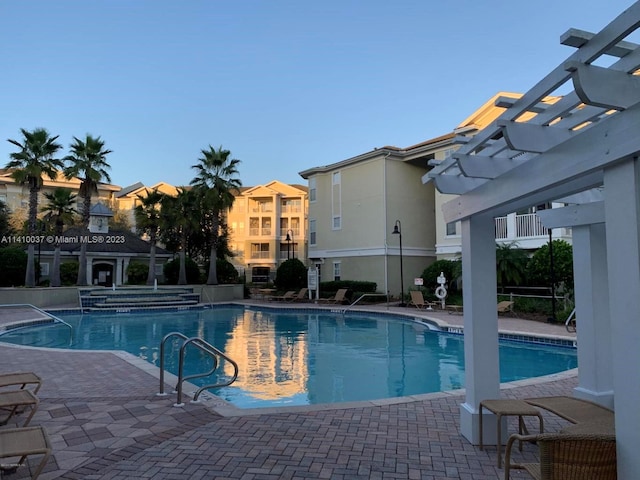 view of pool featuring a patio area and a pergola