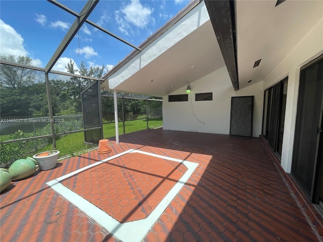 view of patio / terrace featuring glass enclosure