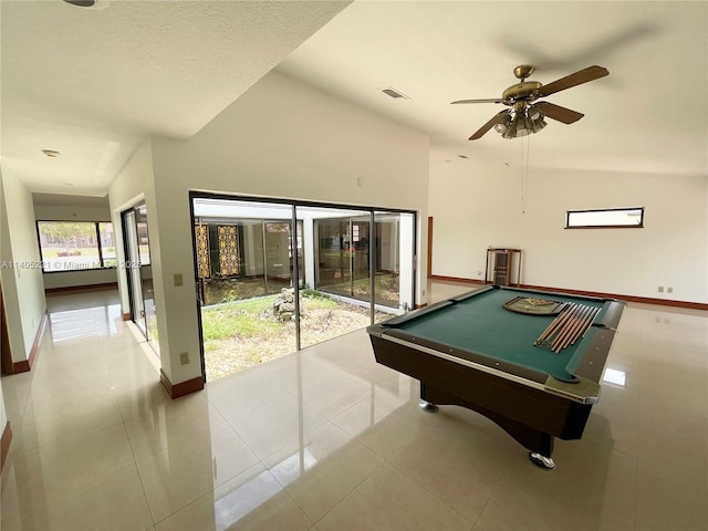 game room with ceiling fan, lofted ceiling, light tile patterned floors, and pool table