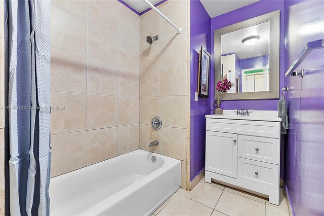 bathroom with vanity, tile patterned flooring, and shower / bath combination with curtain