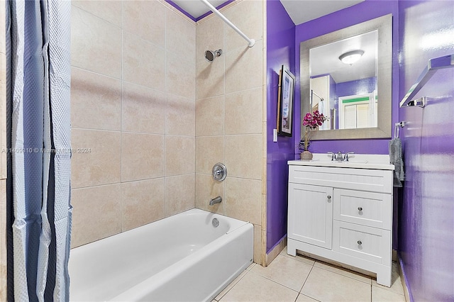 full bath with shower / tub combo, tile patterned flooring, and vanity