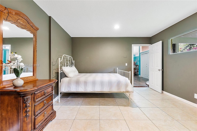 bedroom with light tile patterned flooring