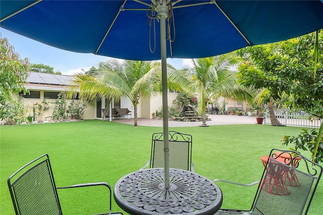 view of yard featuring a patio area and fence