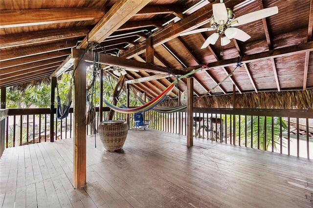 interior space with ceiling fan