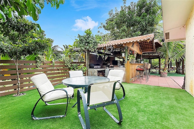 view of yard with an outdoor bar and a patio area