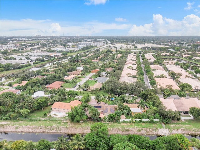 birds eye view of property featuring a water view and a residential view