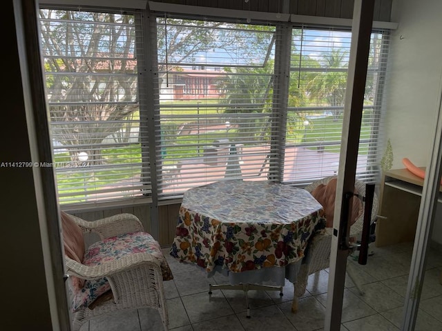 dining space with light tile flooring