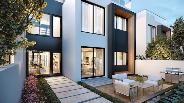 rear view of house with an outdoor hangout area