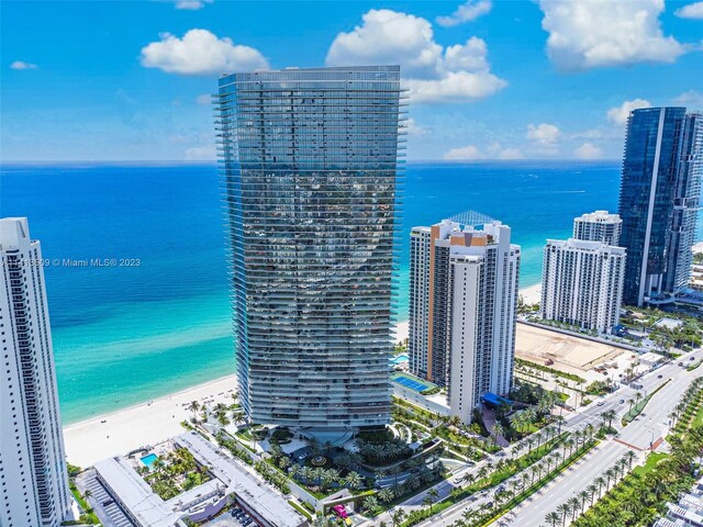 drone / aerial view with a view of the beach and a water view