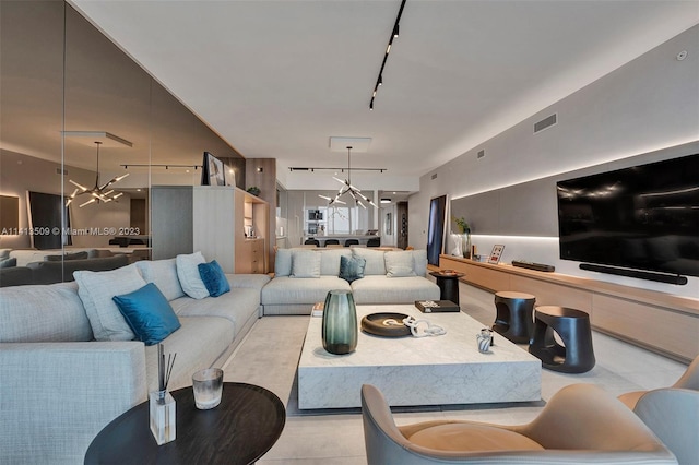 living room with an inviting chandelier