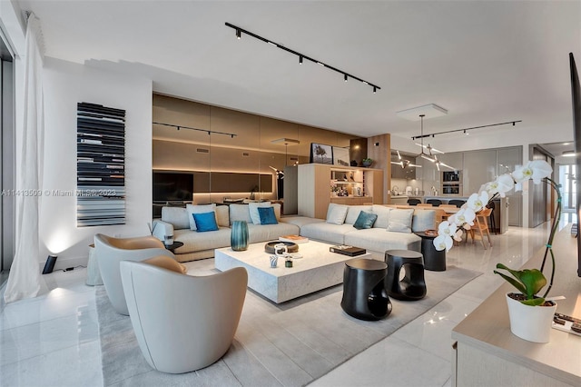 tiled living room featuring track lighting