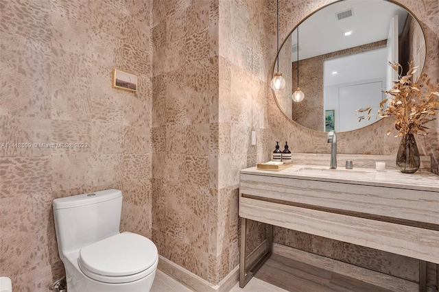 bathroom with vanity and toilet