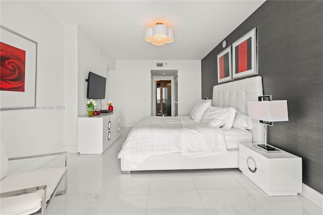 bedroom featuring light tile floors