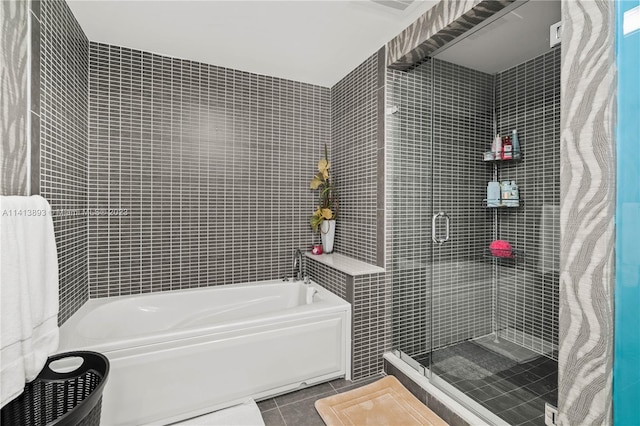 bathroom with a bathing tub and tile floors