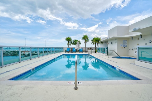 view of swimming pool with a patio area