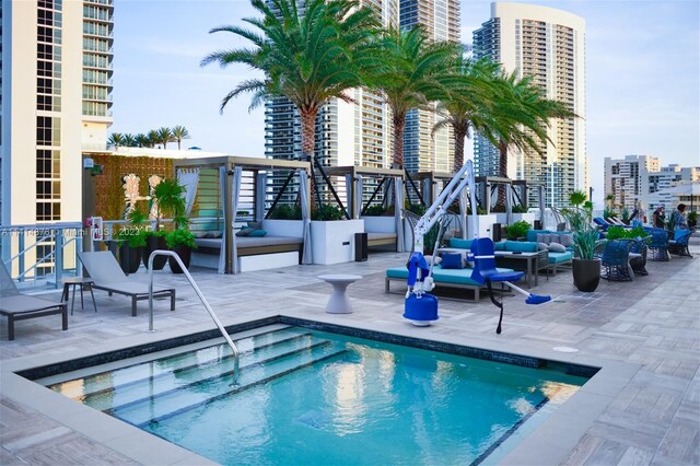 view of swimming pool featuring an outdoor hangout area and a patio